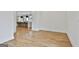 Open living room space with hardwood floors flowing into a kitchen area at 1240 Hayes Sq, Peachtree City, GA 30269