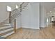 Modern staircase with wooden treads, metal railing, and natural light at 1240 Hayes Sq, Peachtree City, GA 30269