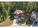 Aerial view showcasing the landscaped lot, house, and surrounding neighborhood at 475 Louise Way, Locust Grove, GA 30248