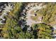 Community aerial view of houses nestled amongst lush trees at 475 Louise Way, Locust Grove, GA 30248