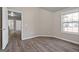 Neutral bedroom featuring natural light and hardwood flooring at 475 Louise Way, Locust Grove, GA 30248