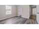 Bedroom with hardwood flooring, neutral walls, and natural light at 475 Louise Way, Locust Grove, GA 30248