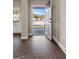 A bright and open entryway featuring hardwood floors, a view of the neighborhood, and a glimpse of the home's interior at 475 Louise Way, Locust Grove, GA 30248