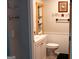 Charming half bathroom featuring white wainscoting and vintage decor at 4076 Airline Rd, Mcdonough, GA 30252