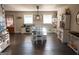 Charming dining room featuring a farmhouse-style table and ample natural light at 4076 Airline Rd, Mcdonough, GA 30252