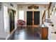 Welcoming foyer with hardwood floors, natural light, and a cozy seating area at 4076 Airline Rd, Mcdonough, GA 30252
