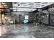 Spacious garage with custom lighting, work out equipment, and polished concrete floors at 4076 Airline Rd, Mcdonough, GA 30252