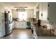 Bright kitchen with white cabinets, granite countertops, and stainless steel appliances at 4076 Airline Rd, Mcdonough, GA 30252