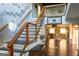 Grand staircase with wooden railing, unique architectural details, and an open floor plan at 4076 Airline Rd, Mcdonough, GA 30252