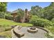 A lovely backyard featuring a stone fire pit perfect for outdoor gatherings at 135 Rockglen Ct, Fayetteville, GA 30215
