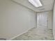 Finished basement area with neutral walls, tiled flooring and closet creating a modern interior space at 135 Rockglen Ct, Fayetteville, GA 30215
