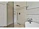 Luxurious bathroom features a glass-enclosed shower and clawfoot tub with black fixtures at 135 Rockglen Ct, Fayetteville, GA 30215
