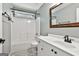 Clean bathroom featuring a new vanity, framed mirror, and shower-tub combination at 135 Rockglen Ct, Fayetteville, GA 30215