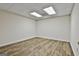 A bedroom showcasing a wood-look floor, neutral walls, and ample space, perfect for customization at 135 Rockglen Ct, Fayetteville, GA 30215