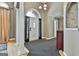 Elegant foyer with high ceilings, decorative columns, and a chandelier at 135 Rockglen Ct, Fayetteville, GA 30215