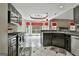 Bright eat-in kitchen features stainless steel appliances and a large bay window overlooking the backyard at 135 Rockglen Ct, Fayetteville, GA 30215