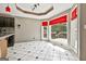 Bright kitchen features a bay window, granite countertops, and updated light fixtures at 135 Rockglen Ct, Fayetteville, GA 30215