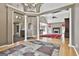 Spacious living area featuring hardwood floors, decorative columns, and an open layout at 135 Rockglen Ct, Fayetteville, GA 30215