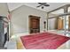 Spacious living room featuring vaulted ceilings, fireplace, hardwood floors, and built-in shelving at 135 Rockglen Ct, Fayetteville, GA 30215