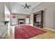 Cozy living area with fireplace, vaulted ceilings, entertainment center, and access to the outdoors at 135 Rockglen Ct, Fayetteville, GA 30215