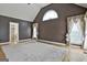 Bright main bedroom with a vaulted ceiling, hardwood floors, and ensuite bathroom access at 135 Rockglen Ct, Fayetteville, GA 30215