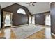 Spacious main bedroom with vaulted ceiling, hardwood floors, and large windows at 135 Rockglen Ct, Fayetteville, GA 30215