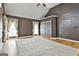Large main bedroom featuring hardwood floors, a vaulted ceiling, and custom curtains at 135 Rockglen Ct, Fayetteville, GA 30215