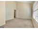 Bedroom features neutral carpet, high ceilings and a large window at 488 N Jeff Davis Dr, Fayetteville, GA 30214