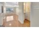 Dining and powder room area with modern chandelier lighting, hardwood floors, and neutral wall at 488 N Jeff Davis Dr, Fayetteville, GA 30214