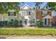 Charming townhome with well-maintained landscaping, dark shutters and a cozy, gated front yard at 488 N Jeff Davis Dr, Fayetteville, GA 30214