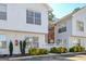 Charming two-story townhouse featuring white siding, well-kept shrubbery, and visible unit number at 488 N Jeff Davis Dr, Fayetteville, GA 30214