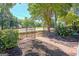 Brick walkway surrounded by black mulch and greenery leads to a townhome's entry gate at 488 N Jeff Davis Dr, Fayetteville, GA 30214