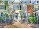 Charming walkway leads to townhome with beautiful landscaping and fenced yard at 488 N Jeff Davis Dr, Fayetteville, GA 30214