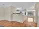 View of the kitchen and dining area, featuring sleek white appliances and a breakfast bar at 488 N Jeff Davis Dr, Fayetteville, GA 30214