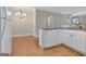Kitchen area with dishwasher, view of the dining area, and kitchen bar at 488 N Jeff Davis Dr, Fayetteville, GA 30214