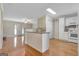 Bright kitchen open to the living area with granite counters, an open layout, and pantry at 488 N Jeff Davis Dr, Fayetteville, GA 30214