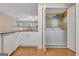 The kitchen adjacent to laundry closet includes washer, dryer, and granite counters at 488 N Jeff Davis Dr, Fayetteville, GA 30214