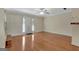 Bright living room showcases gleaming hardwood floors, a front door, and neutral paint at 488 N Jeff Davis Dr, Fayetteville, GA 30214