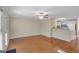 Open-concept living room with hardwood floors flows into the kitchen with a breakfast bar at 488 N Jeff Davis Dr, Fayetteville, GA 30214