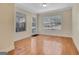 Living room boasts hardwood floors, natural light from windows and a view of the entryway at 488 N Jeff Davis Dr, Fayetteville, GA 30214