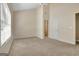 Spacious main bedroom boasting plush carpet, high ceilings and a window at 488 N Jeff Davis Dr, Fayetteville, GA 30214