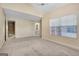 Large main bedroom showcasing plush carpet, vaulted ceiling, and ensuite bathroom at 488 N Jeff Davis Dr, Fayetteville, GA 30214