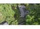 Aerial view of a charming home nestled amongst mature trees and lush landscaping at 23 Hunting Creek Dr, Marietta, GA 30068