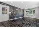 Finished basement offers tiled floor, a painted wall, and a bright window showcasing natural light at 23 Hunting Creek Dr, Marietta, GA 30068