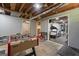 Basement recreation area with a foosball table and open doorway to the home gym at 23 Hunting Creek Dr, Marietta, GA 30068