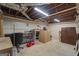 Basement featuring built-in shelving, peg board, storage cabinets, and concrete floors at 23 Hunting Creek Dr, Marietta, GA 30068