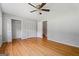 Bedroom featuring hardwood floors, a ceiling fan and direct access to the stairway via an interior door at 23 Hunting Creek Dr, Marietta, GA 30068