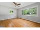 This bedroom is illuminated by a window providing natural light, complementing the beautiful hardwood floors at 23 Hunting Creek Dr, Marietta, GA 30068