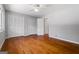 Bedroom featuring hardwood floors, ceiling fan, closet and a door leading to other rooms at 23 Hunting Creek Dr, Marietta, GA 30068