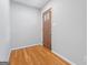 Clean entryway showcasing hardwood floors and a wooden front door with decorative glass at 23 Hunting Creek Dr, Marietta, GA 30068